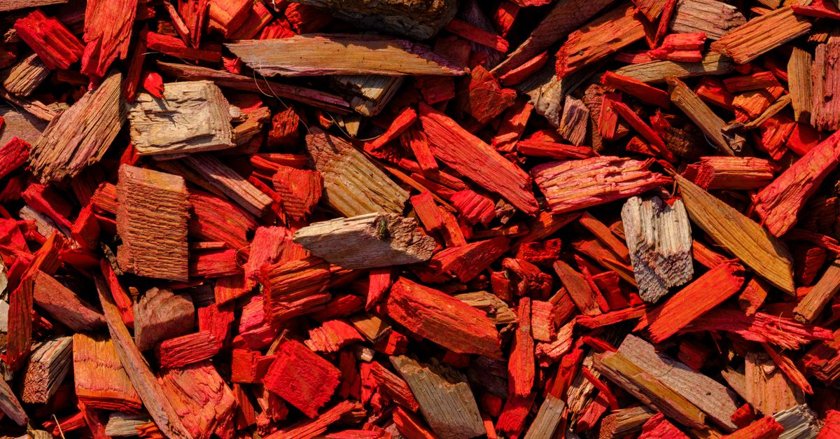 Close-up of fresh red mulch in a landscaped bed